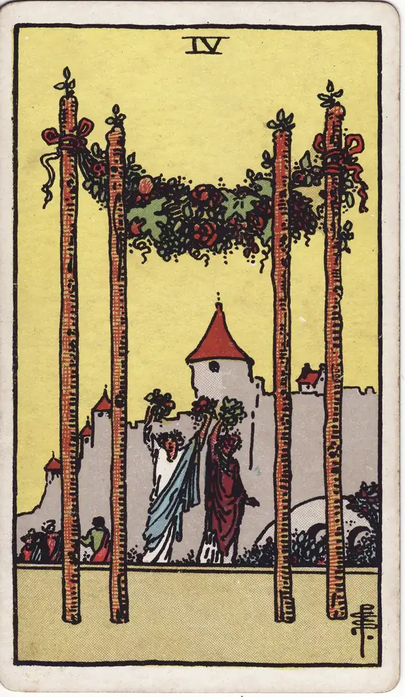 Karta tarota „Czwórka Buław tarot – znaczenie karty Four of Wands” z talii Rider–Waite–Smith.